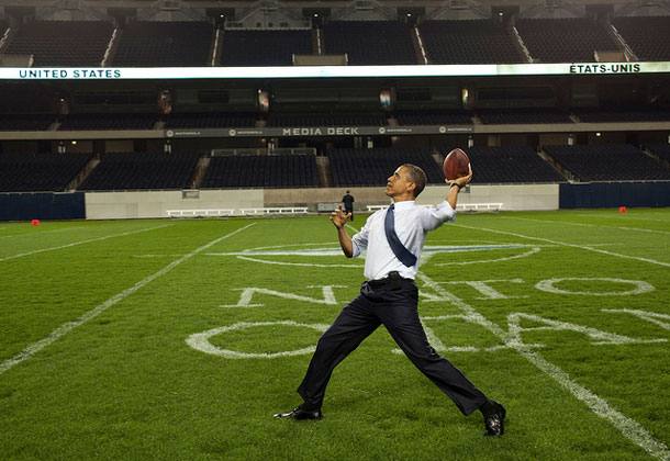 President Barack Obama throws a football on the field at Soldier Field following the NATO working dinner in Chicago, 2012. | Pete Souza, White House photographer
