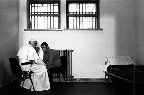 Pope John Paul II talks with Turkish gunman Mehmet Ali Ağca in a cell of Rome's Rebibbia prison on December 2, 1983. | Arturo Mari